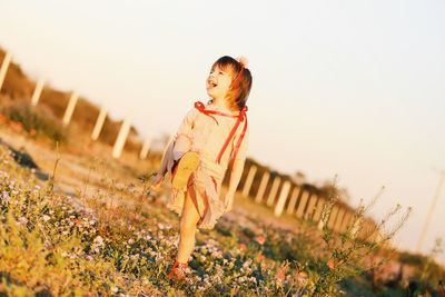 Smiling girl standing on land