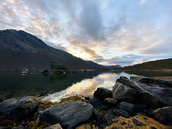 Scenic view of lake against sky during sunset