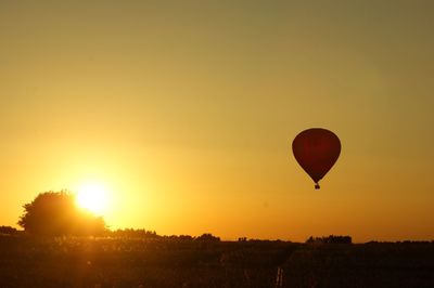 Hot air balloon flying over landscape