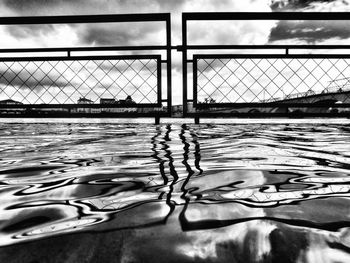 Close-up of rippled water against cloudy sky