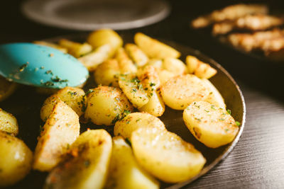 Close-up of prepared potatoes served in plate on table