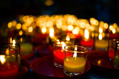 Close-up of tea light candles on table