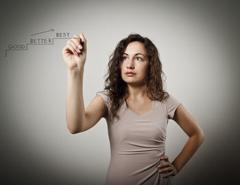 Portrait of a beautiful young woman over white background