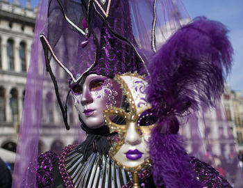 Close-up portrait of woman wearing mask