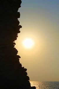 Scenic view of sea against sky at sunset