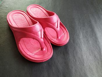 High angle view of pink shoes on table