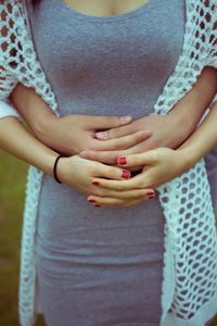 Cropped hands of man holding girlfriend