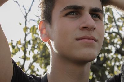 Close-up of thoughtful teenage boy looking away