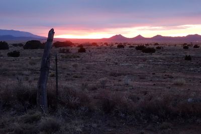 Scenic view of landscape against sky during sunset