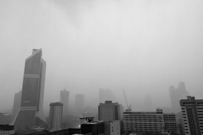 Modern buildings in city against sky