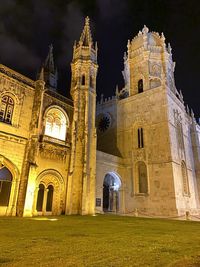 Low angle view of historic building against sky at night