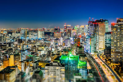 High angle view of illuminated buildings in city against sky