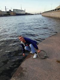 Woman sitting in water