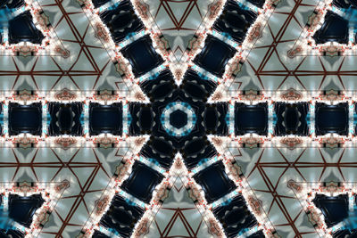 Directly below shot of ferris wheel against sky