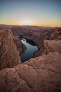 Scenic view of rock formations against sky during sunset