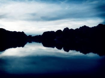 Reflection of clouds in calm lake