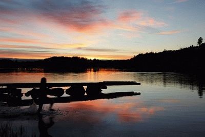 Scenic view of lake at sunset