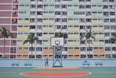 Basketball hoop against residential building