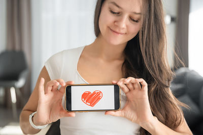 Young woman using mobile phone