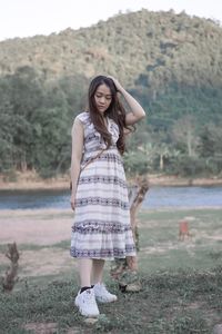 Portrait of woman standing in water