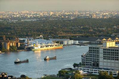 High angle view of river and buildings in city