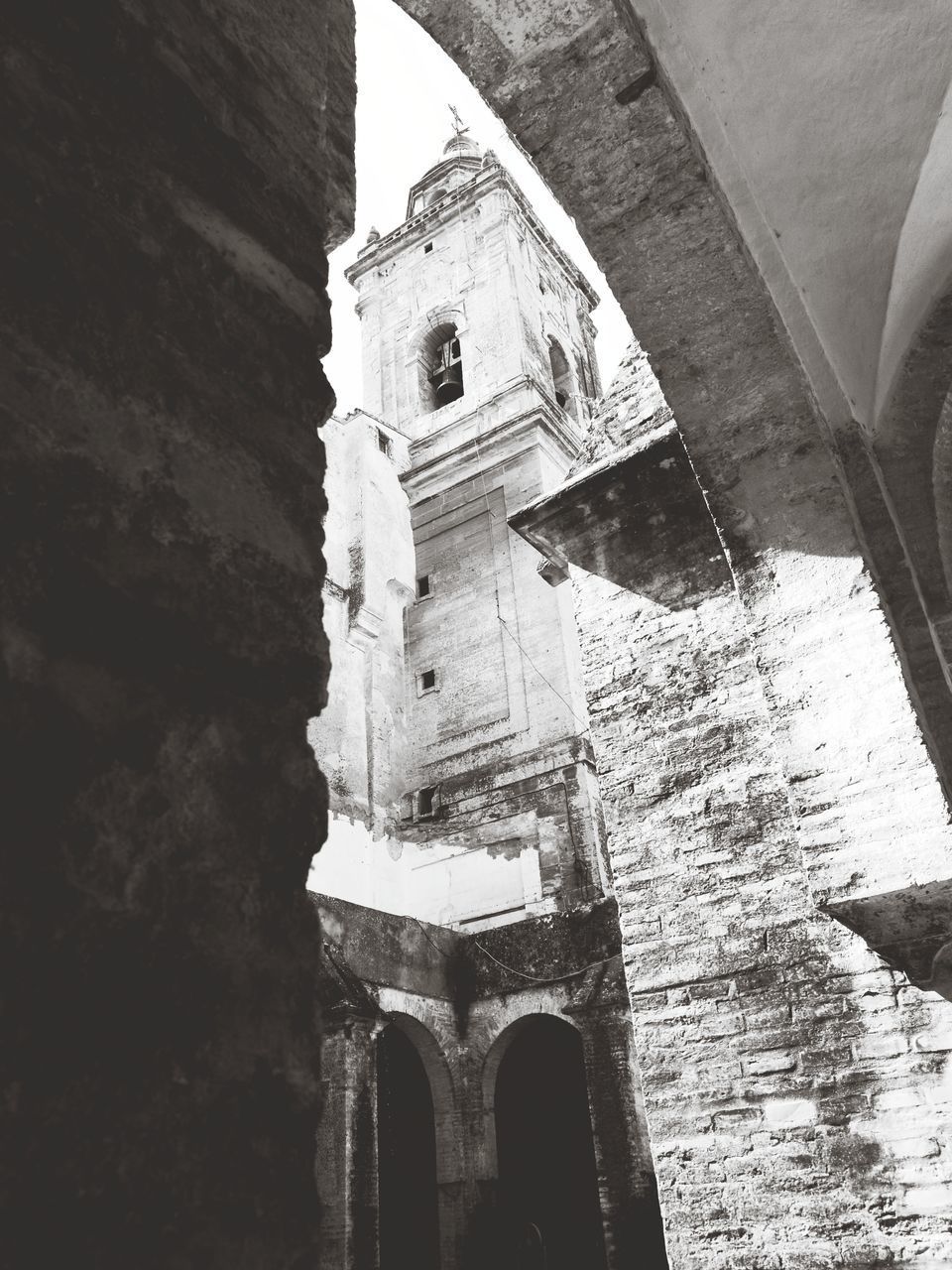 LOW ANGLE VIEW OF BELL TOWER AGAINST CHURCH