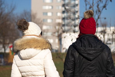 Rear view of women wearing warm clothing