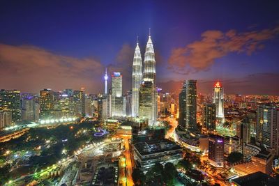 Aerial view of city lit up at night