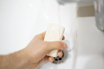 Close-up of person holding glass