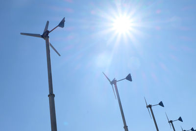 Low angle view of wind turbine against sky