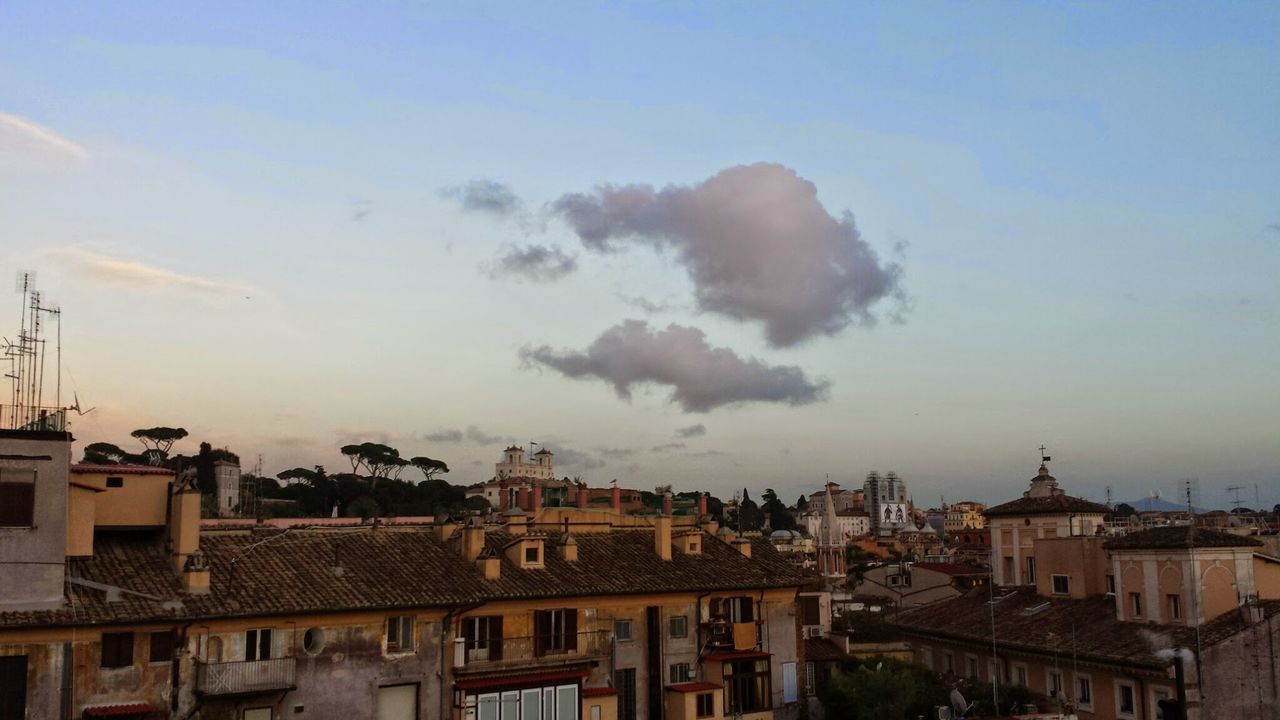 architecture, building exterior, built structure, sky, city, cityscape, residential building, residential structure, residential district, cloud - sky, outdoors, travel destinations, building, no people, dome, sunset, copy space, high section, roof, low angle view