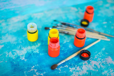 High angle view of multi colored glasses on table