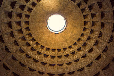 Upward picture of the amazing architecture ceiling of pantheon, important landmark of rome, italy