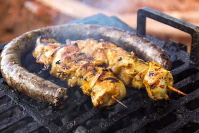 Sosaties on a braaier during a braai 