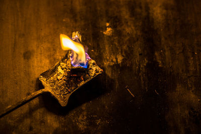 Close-up of illuminated candle