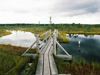 Wooden footbridge over river