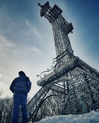 Low angle view of tower against cloudy sky