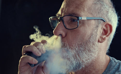 Portrait of man wearing eyeglasses