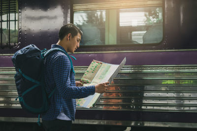 Man looking at train window