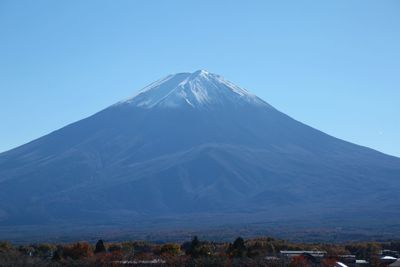 Scenic view of mountains against clear blue sky