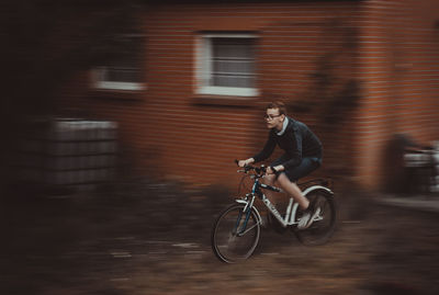 Man riding bicycle on street