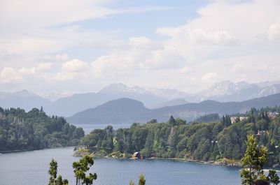 Scenic view of lake and mountains against sky