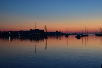 Silhouette of marina at sunset