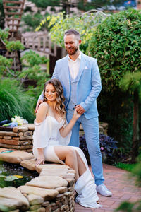 Rear view of couple sitting outdoors