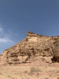Rock formations on landscape against clear sky