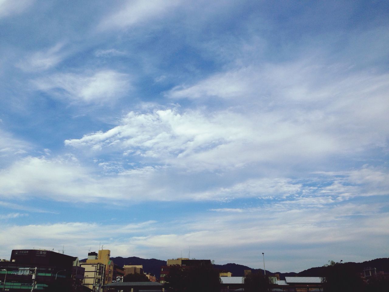 building exterior, architecture, built structure, sky, cloud - sky, city, residential building, cloudy, residential structure, cloud, cityscape, residential district, low angle view, building, house, outdoors, no people, day, nature, blue