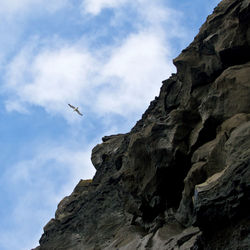 Low angle view of rocks against sky