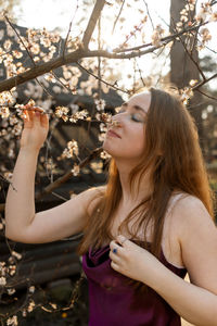 Side view of young woman looking away