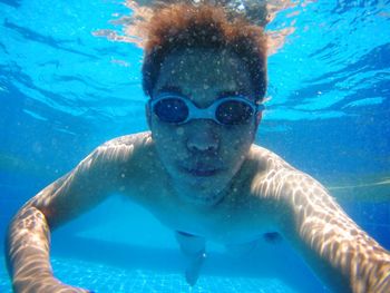 Portrait of man swimming in sea