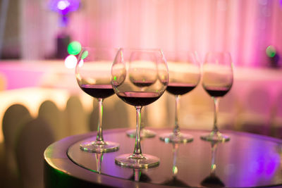 Close-up of wine glasses on table